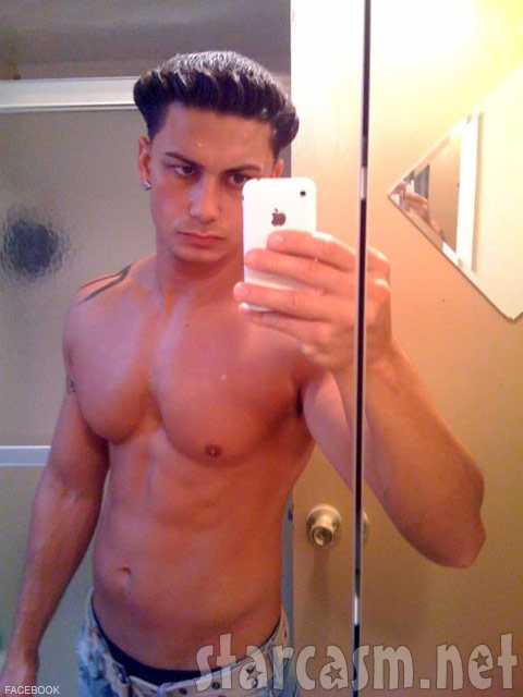 Pauly D snaps a cell phone photo of himself and his blowout hairstyle