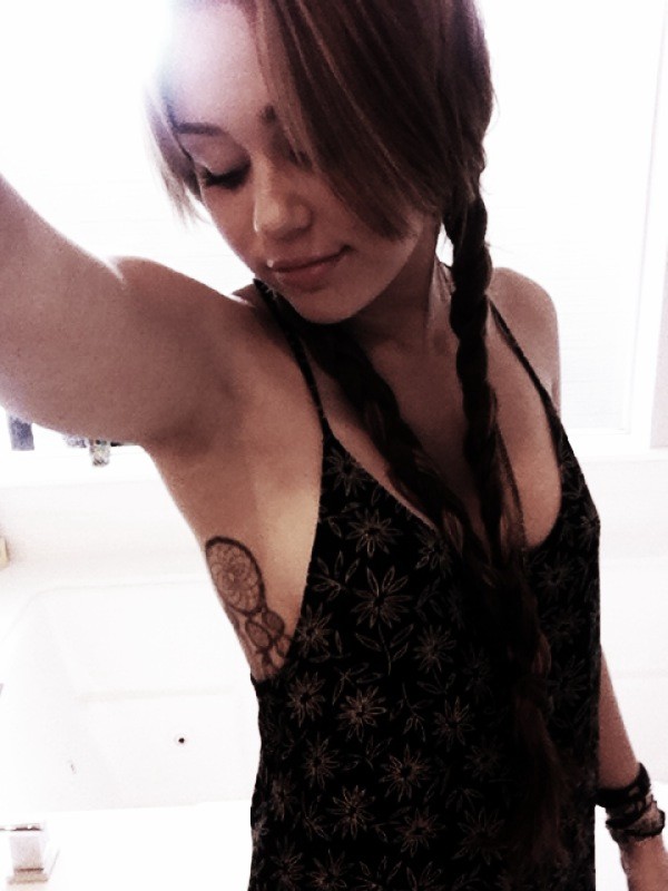 Miley Cyrus side boob tattoo boob tattoo