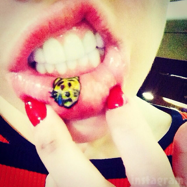 Miley Cyrus lip tattoo photos, plus she rolls a joint with Wayne Coyne