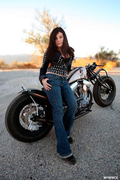 Brigitte Daguerre poses with a motorcycle