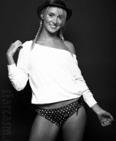 Francine Cornell poses in a hat, shirt and lingerie