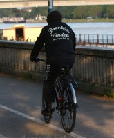 Bob Dylan bicycling in a Brooklyn Vinders Motorcycle club jacket