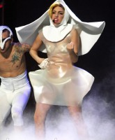 Lady Gaga wears a flying nun comdon outfit on stage