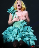 Lady Gaga wears a dress made of over-sized turquoise crystals