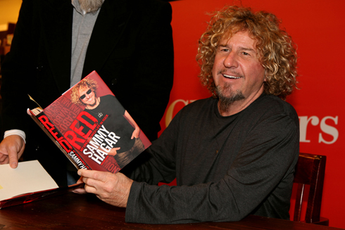 Sammy Hagar signs his autobiography "Red: My Uncensored Life in Rock"