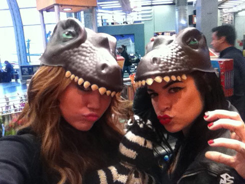 Miley Cyrus wears a dinosaur hat 'RA RA like a dungeon dragon!'
