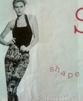 Brandi Glanville modeling photo on what appears to be a shopping bag