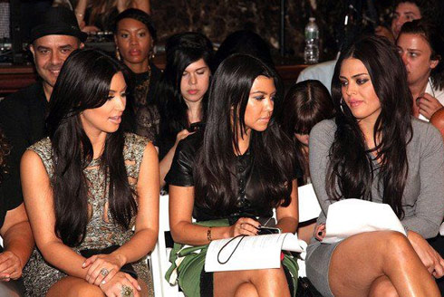 Kim Kardashian and Kourtney Kardashian at the Sherri Hill Spring 2012 fashion show