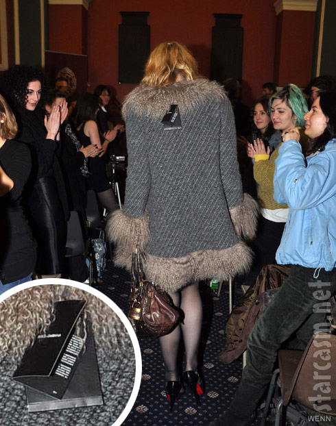 Courtney Love wears a coat with the tags still attached to Honorary Patronage ceremony
