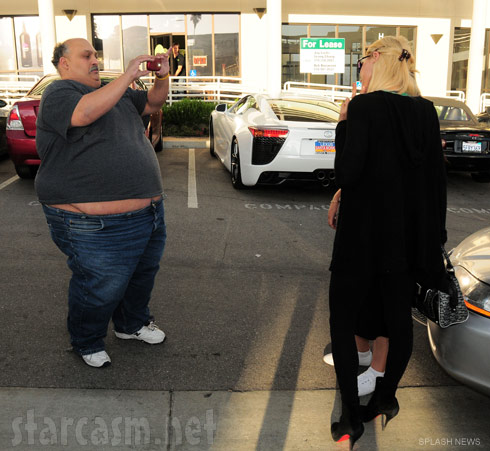 Paris Hilton poses for photos for a huge fan of hers