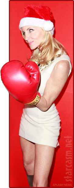 Camille Grammer wearing an over-sized boxing glove