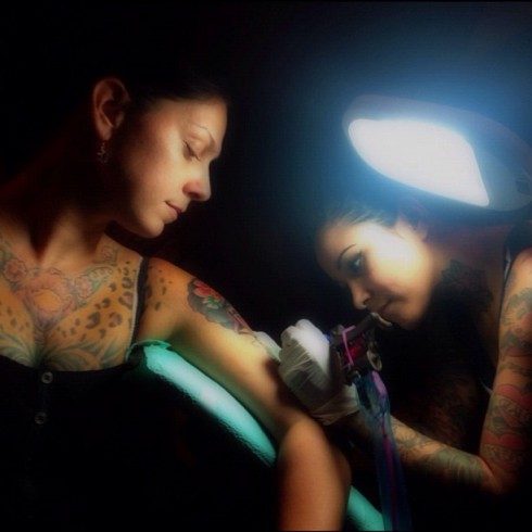 American Pickers Danielle Colby Cushman getting a tattoo of painter Frida Kahlo on her arm