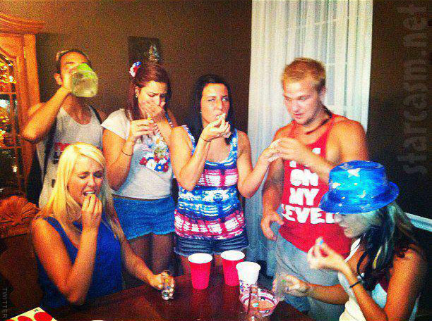 Maci Bookout at the Bookout cookout 4th of July bash appearing to slam a shot of tequila