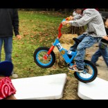 Maci Bookout's son Bentley jumps a ramp n a bicycle during his 4th birthday party