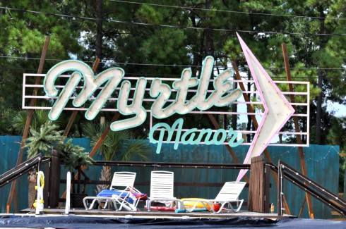 TLC Welcome to Myrtle Manor logo sign