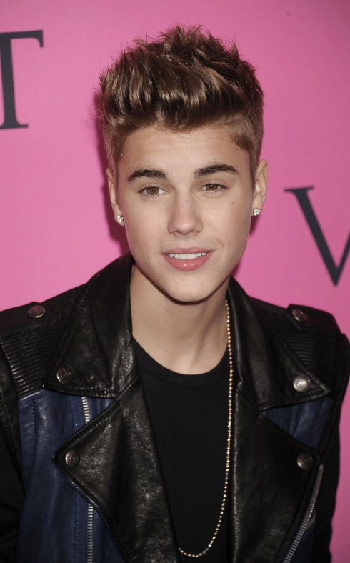 Justin Bieber attends the 2011 Victoria's Secret Fashion Show at the Lexington Avenue Armory in New York City, USA.