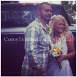 Corey Simms wedding photo wearing flannel and jeans