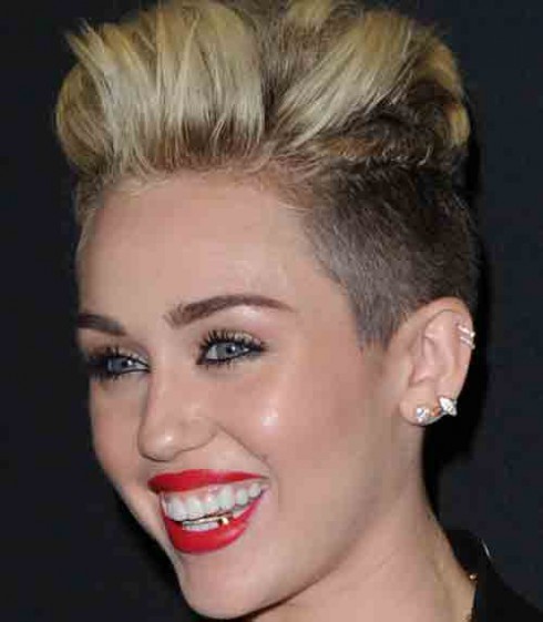 Miley Cyrus has a gold tooth in her grill - starcasm.net