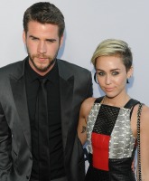 PHOTOS Miley Cyrus and Liam Hemsworth walk the red carpet together at Paranoia premiere