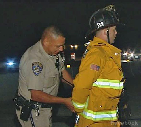 VIDEO Cop Handcuffs Firefighter Over Parking Row During Crash Rescue