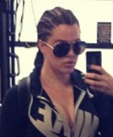 PHOTOS Khloe Kardashian debuts cornrows at the gym