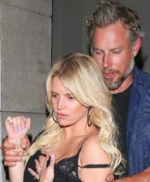 PHOTOS Jessica Simpson stumbles out of club with bra on full display
