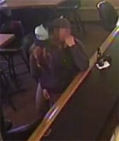 VIDEO Kissing couple keep kissing while bar is robbed at gunpoint
